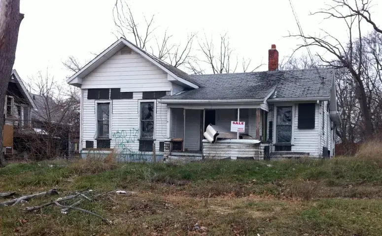House for sale in a tranquil rural area surrounded by open fields and greenery in Allen Park, MI